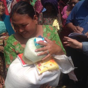 Villager receiving rice.